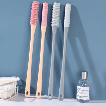 Four cleaning brushes with different bristle patterns on a blue background